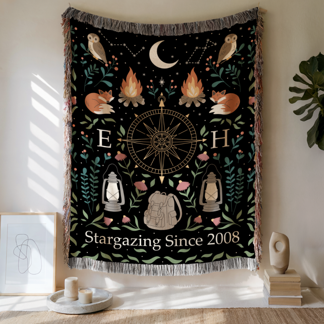 Decorative tapestry with stargazing design hanging on a wall.