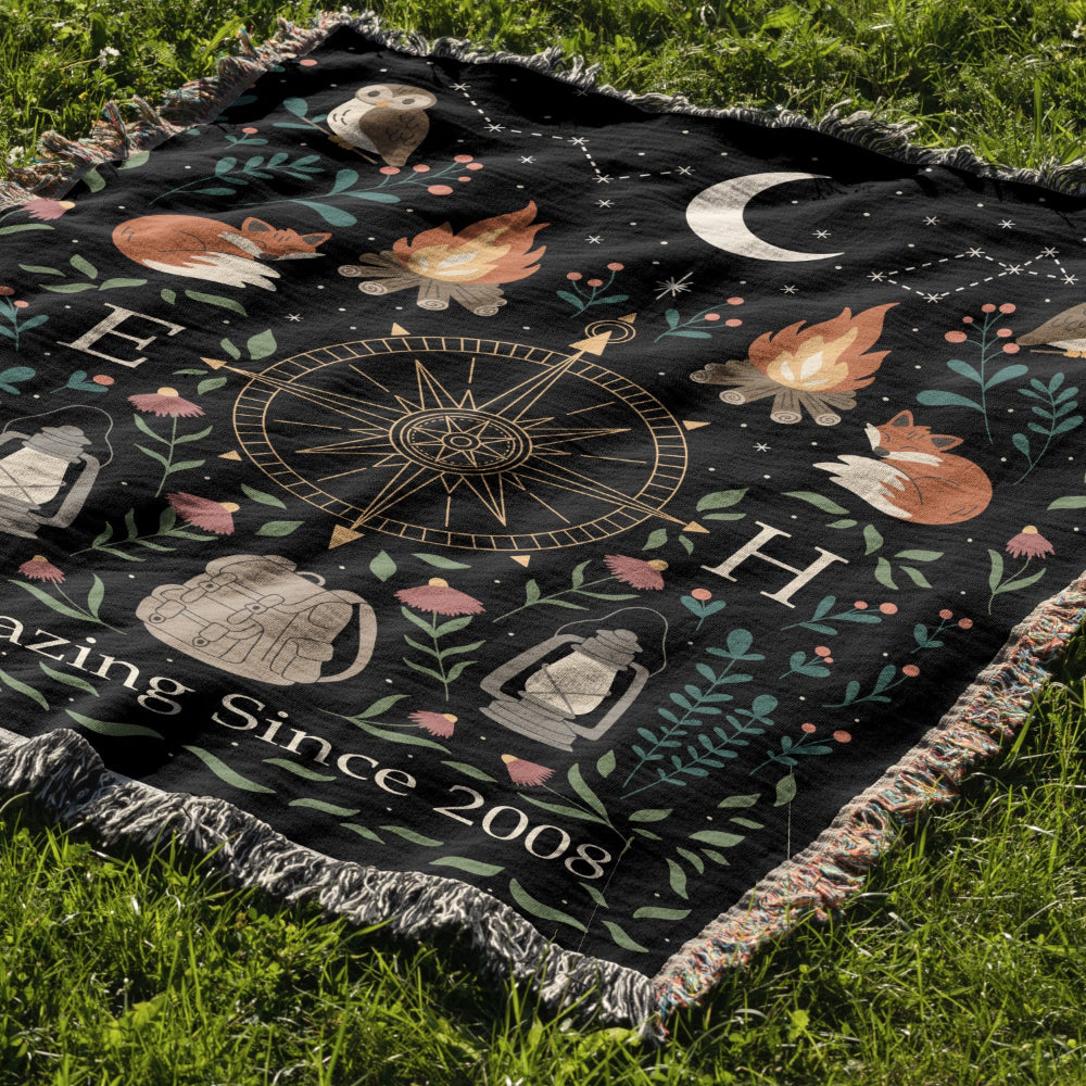 Decorative blanket with nature-themed design on grass