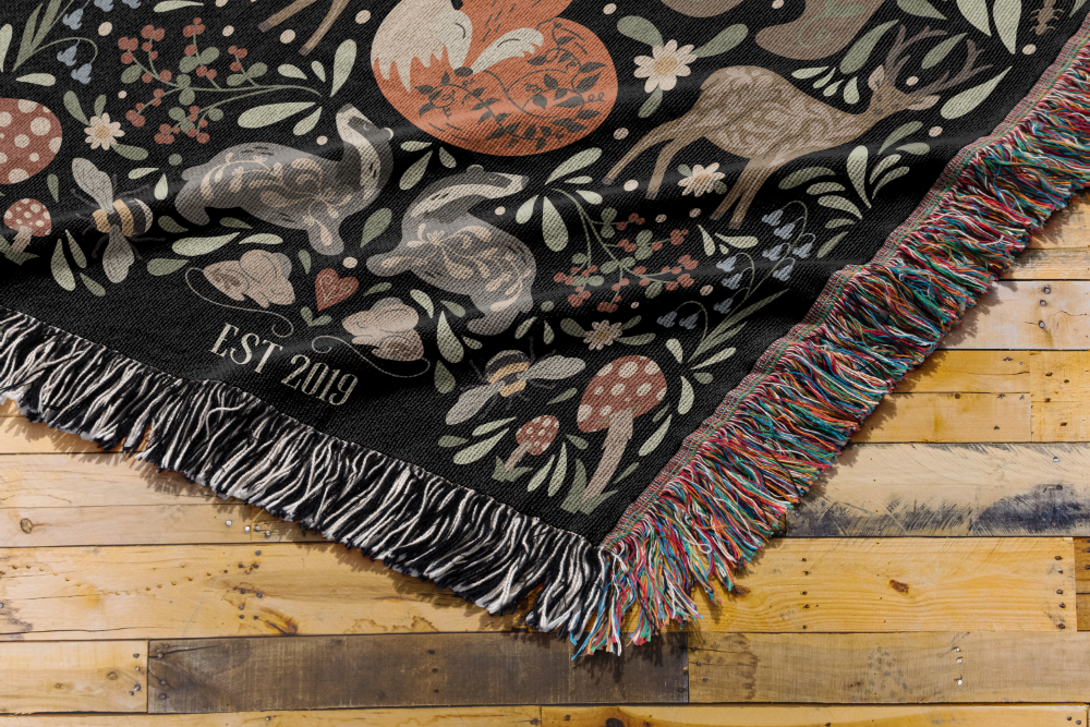 Decorative blanket with animal patterns on a wooden surface